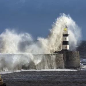 Waves crashing over lighthouse