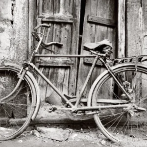 Black and white old bicycle in front of door