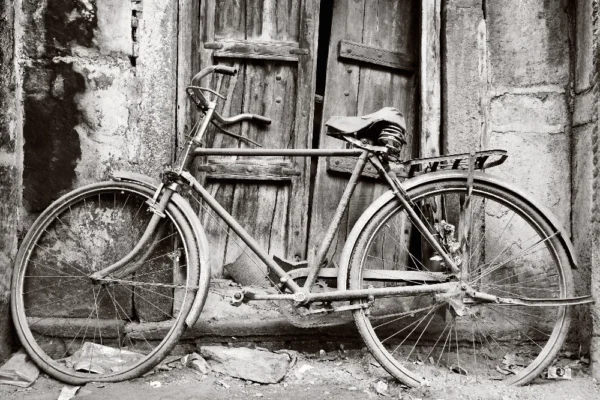 Black and white old bicycle in front of door