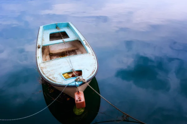 old small boat lying in the shadows